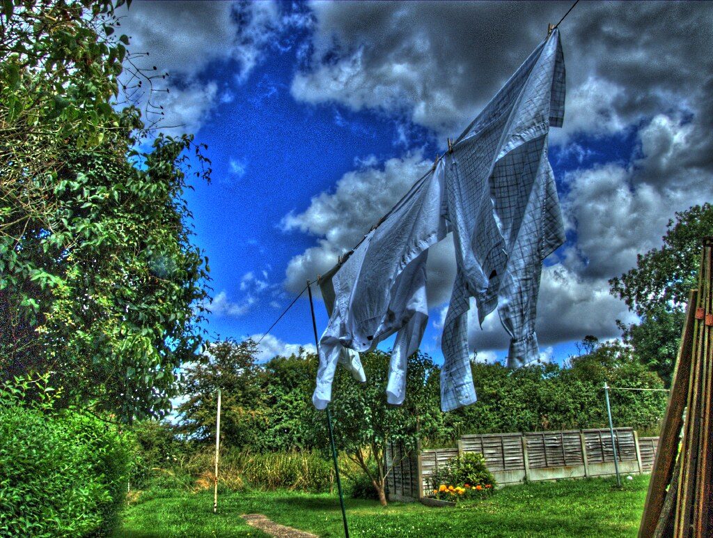 Washing drying on a garden clothesline under a big sky — small outdoor jobs around the section