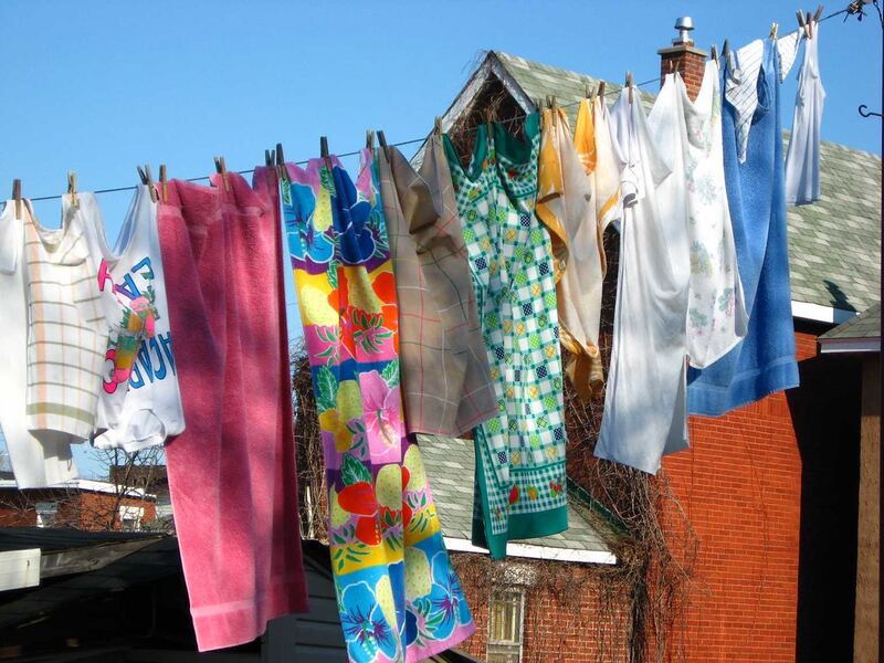 Colourful washing hung on an outdoor clothesline under a blue sky — clothes line installation Selwyn