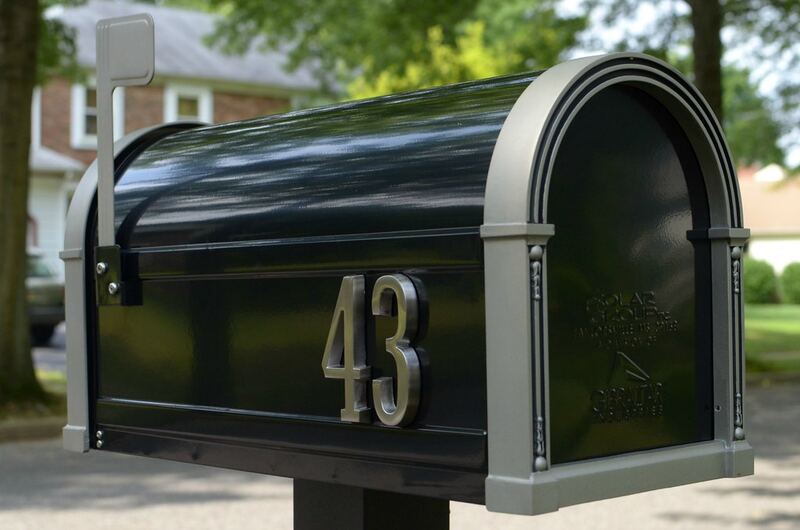 New post-mounted letterbox with street number in a suburban front yard — letterbox building Selwyn